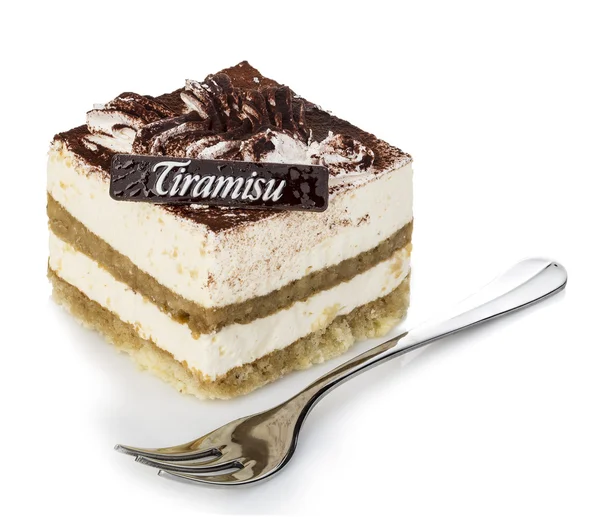 Dessert tiramisù con forchetta primo piano su fondo bianco . — Foto Stock