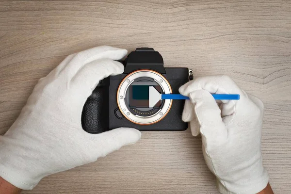 Cleaning a modern digital full-frame camera sensor using a sensor swab