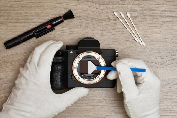 Removing sensor dust from a modern digital full frame camera sensor with a cotton sensor swap