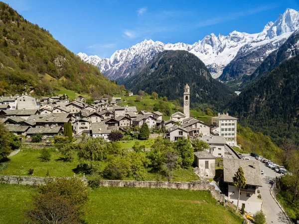 Aerial image of the Swiss mountain village Solio with the snow-capped Sciora range at the background. Soglio was creadited as one the most beautiful village in Switzerland.