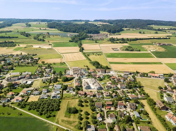 villages in the suburban surrounding by farming fields by aerial drone photogrpaphy