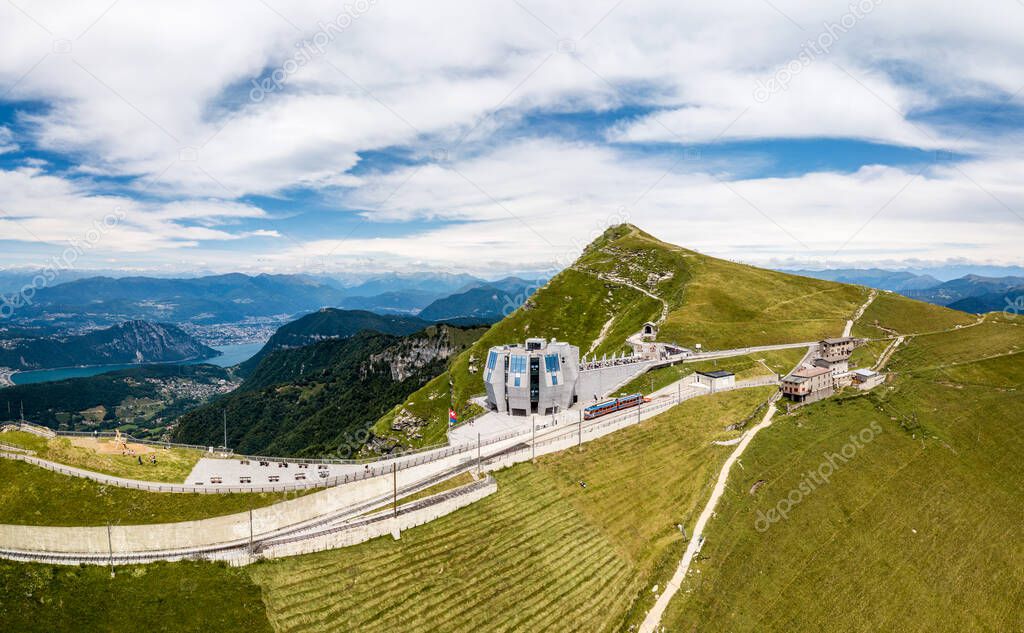 The popular excursion destination on the 1700 m. high monte Generoso with a modern restaurant and diverse hiking trails, Lugano lake areal at the background, Canton Ticino, Switzerland