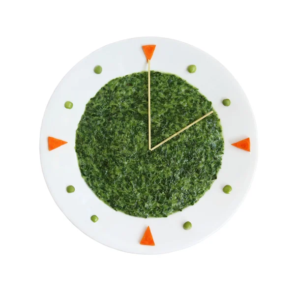 Żywności zegar - płyta z zarezerwowane szpinak — Zdjęcie stockowe