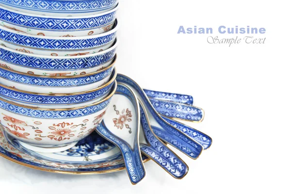 Pile of Bowls and spoons of Asican cuisine, with copy space for text — Stock Photo, Image