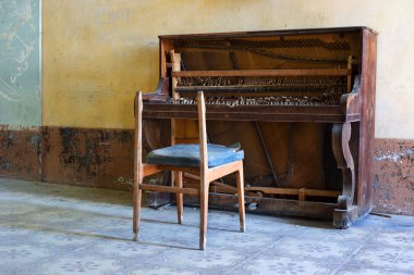 Abandoned piano and chair clipart