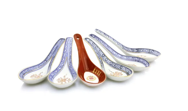 Chinese soup spoons - one is different — Stock Photo, Image