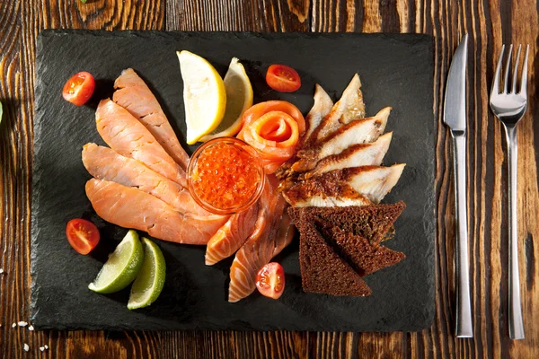 Fish Plate on Black DIsh — Stock Photo, Image