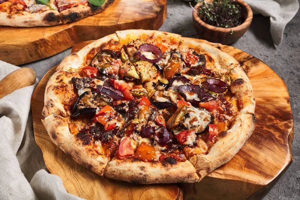 BBQ Pizza with Onions and Seasons Vegetables. Garnished on wooden tray