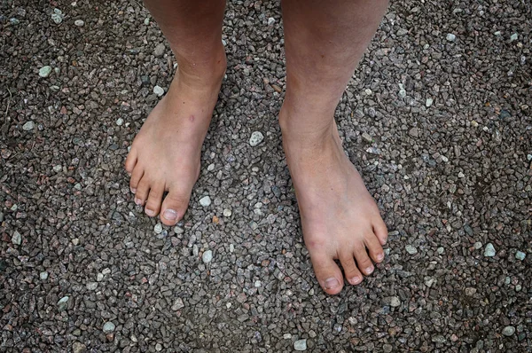 Bare feet in gravel — Stock Photo, Image