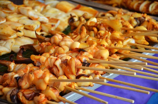 Grilled squids on stick — Stock Photo, Image