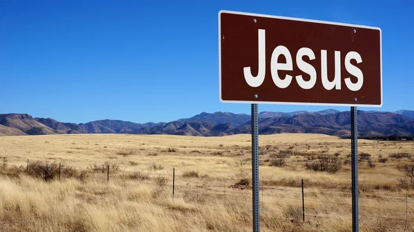 Иисус коричневый знак дороги — стоковое фото