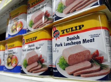 SINGAPORE, 20 SEP: Tulip luncheon meat cans are being sold in th clipart