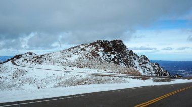Road to the Pikes Peak, Colorado in the winter clipart