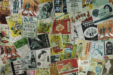 Vintage advertisement papers paste on the wall in Hong Kong clipart