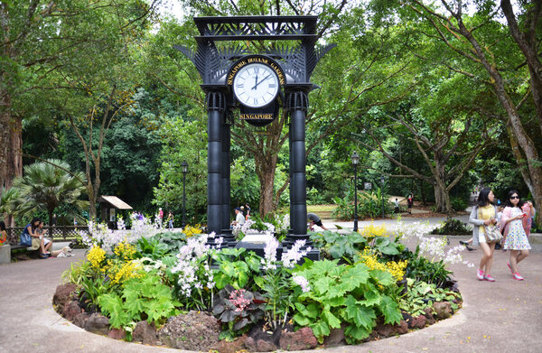 People walk through the Singapore Botanic Gardens