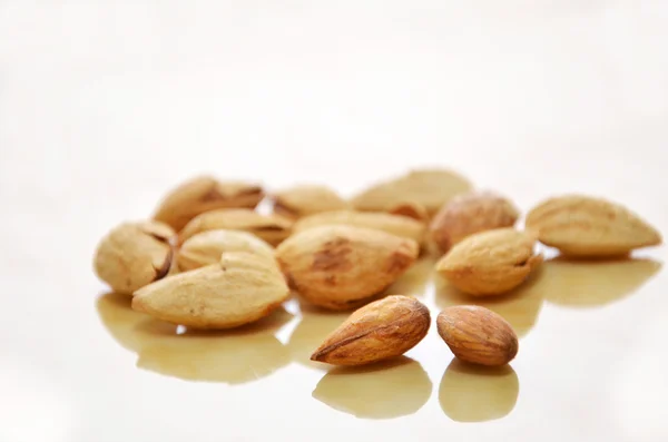 Almonds on white  floor — Stock Photo, Image