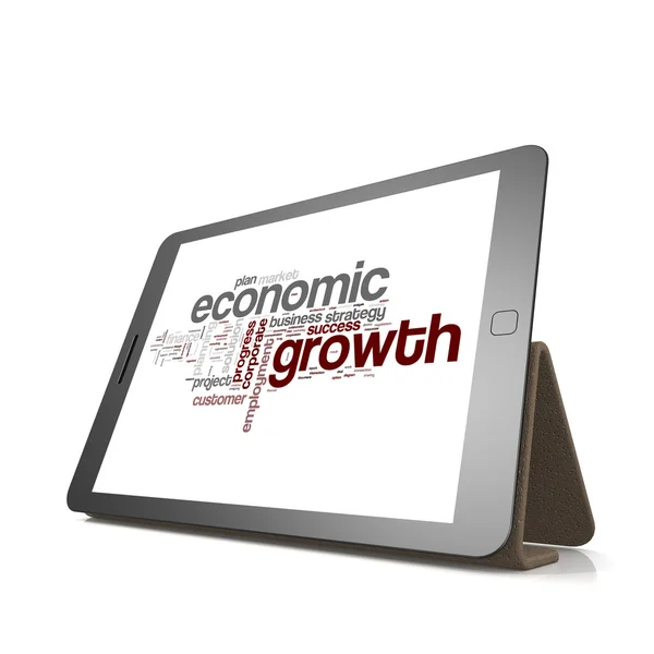 Hospodářský růst slovo mrak na tabletu — Stock fotografie