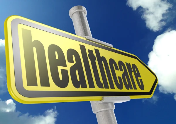 Yellow road sign with healthcare word under blue sky — Stock Photo, Image