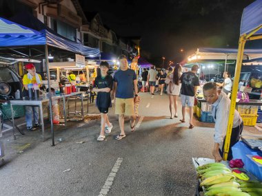 Johor Bahru, Malaysia- 2 Oct 2025:  People visit to a local night market in Johor Bahru, Malaysia. Also called as pasar malam, it is a popular place for local people to shop