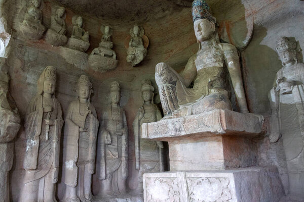 Rock sculptures of Buddha at Beishan Rock Carvings in Dazu, China. Dazu Rock Carvings have over 50,000 statues, integrating Buddhism, Daoism, and Confucianism.