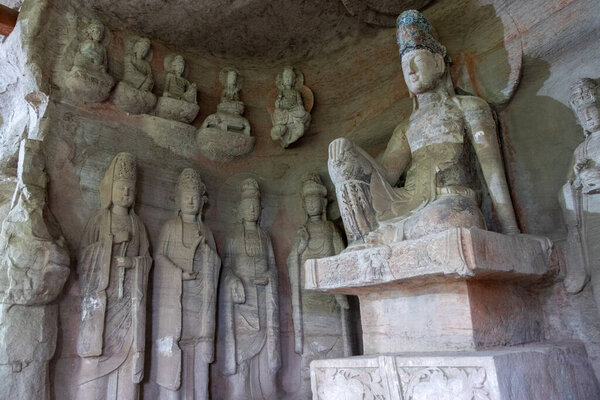 Rock sculptures of Buddha at Beishan Rock Carvings in Dazu, China. Dazu Rock Carvings have over 50,000 statues, integrating Buddhism, Daoism, and Confucianism.