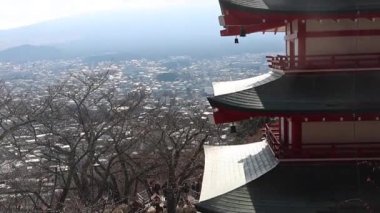 Fujiyoshida, Japan- 19 Dec 2025: Mount Fuji and Chureito Pagoda from Arakurayama Sengen Park in Fujiyoshida, Japan. The park offers a stunning view of Mount Fuji, especially framed by pagoda
