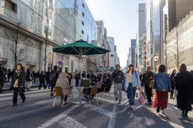 Tokyo, Japan-28 Dec 2025: Ginza main street, Chuo Dori, becomes a pedestrian-only zone on weekend afternoons. Creating a lively, car-free shopping and strolling area filled with luxury stores
