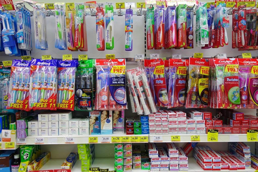 Oral care products on the shelves of a grocery store in Johor, M