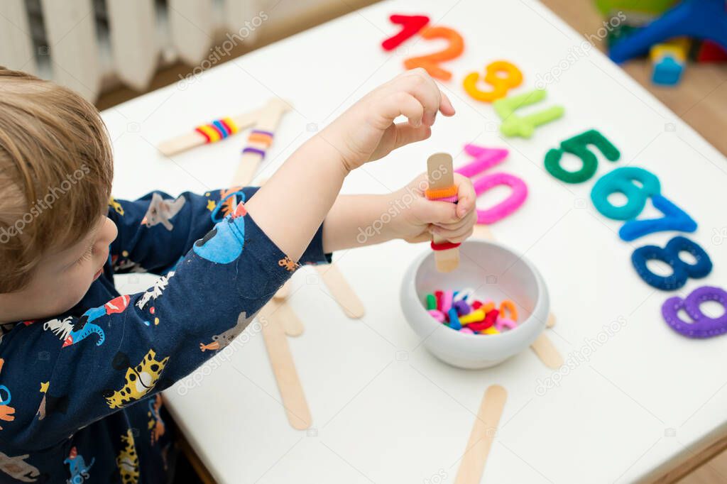 logic and counting game for early education. Stuffed felt numbers and Popsicle Sticks with hair tie gum on it. Each popsicle have dedicated number of ring.