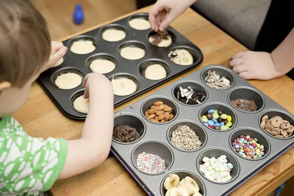 Boy Decorating Cupcake Taking Sprinkles Nuts Decorations Baking Form Baking Stock Photo