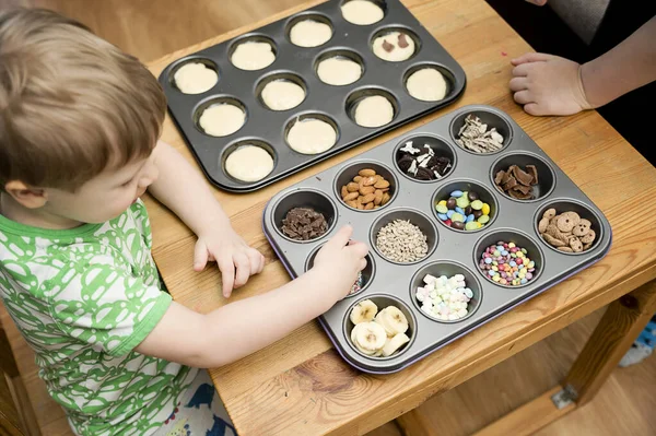 Boy Decorating Cupcake Taking Sprinkles Nuts Decorations Baking Form Baking Stock Image