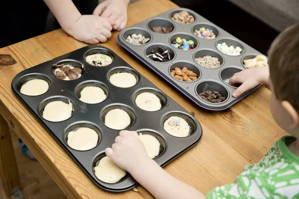 Boy Decorating Cupcake Taking Sprinkles Nuts Decorations Baking Form Baking Stock Picture