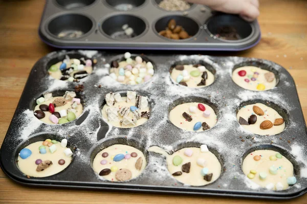 Boy Decorating Cupcake Taking Sprinkles Nuts Decorations Baking Form Baking Royalty Free Stock Photos