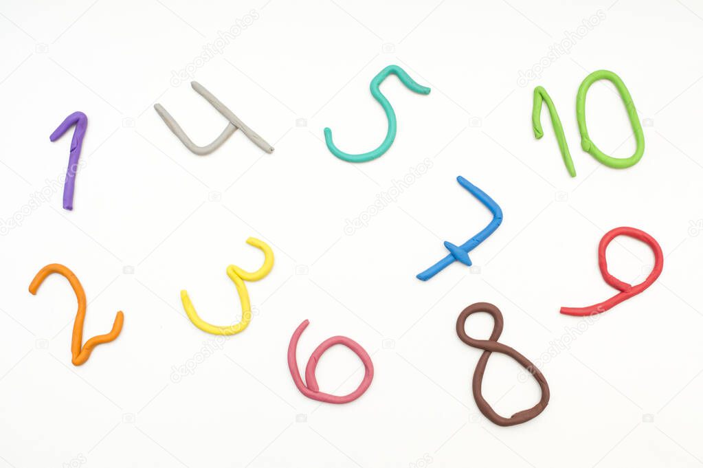 Colorful digits made from plasticine. Bright colored volumetric figures for children (isolated on white)