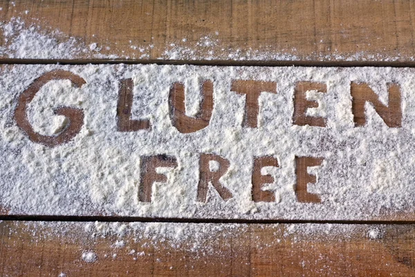 Palabra sin gluten con fondo de madera — Foto de Stock
