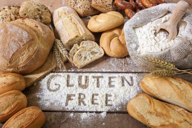 gluten free breads on wood background clipart