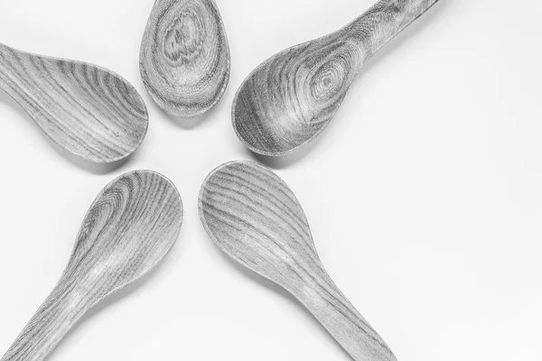 Black and white view of Five Classic wooden spoon on white background and selective focus — Stock Photo, Image