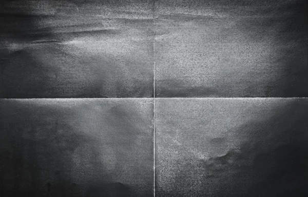 4 つの部分に折り畳まれた黒い紙の背景パターン — ストック写真