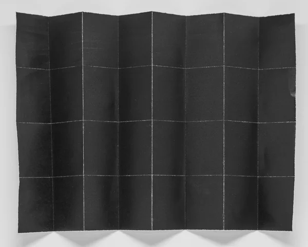 Papel negro plegado en 32 partes con fondo blanco —  Fotos de Stock