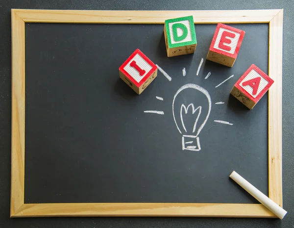 Colorful wooden word Idea with lamp drawing on Blackboard3 — Stock Photo, Image