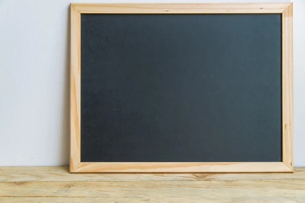 Blank black board on the wall 1 — Stock Photo, Image