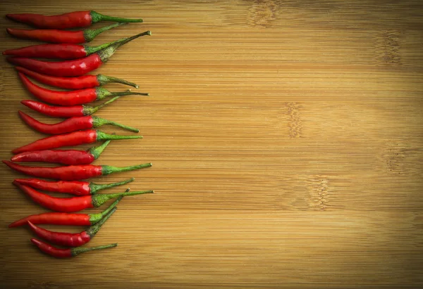 Red chilli pepper on Left side of chopping block 2 — Stock Photo, Image