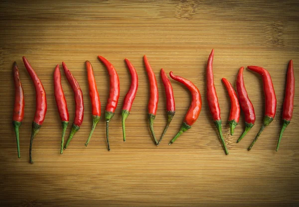 Red chilli pepper on chopping block 2 — Stock Photo, Image