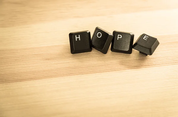 Hope word keyboard on wooden floor in retro style — Stock Photo, Image