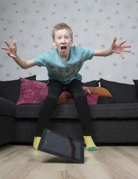 Tablet slipping out of hands — Stock Photo, Image