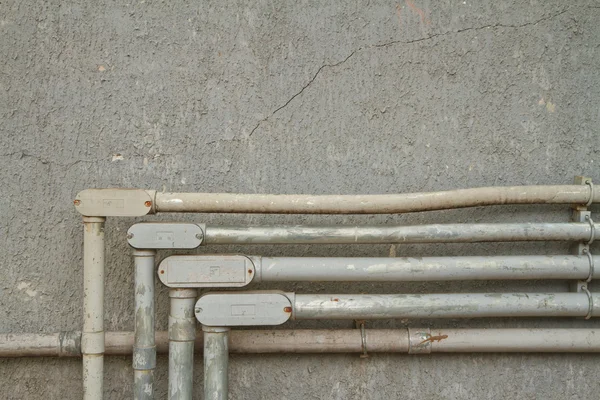 Wire in old pipe — Stock Photo, Image