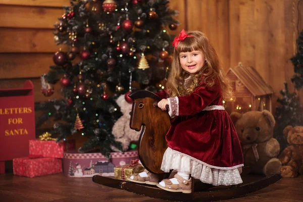 Little Girl Rocking Horse Posing Room Christmas Decorations — Stock Photo, Image