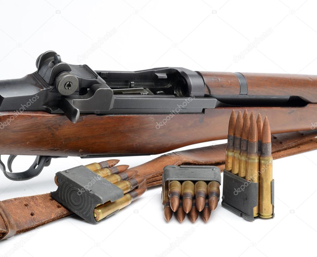 M1 Garand Rifle, clips and ammunition on white background.