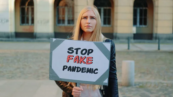 Young woman protesting against fake pandemic