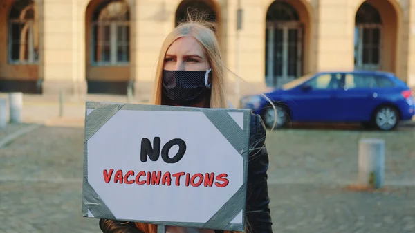 Young woman protesting against vaccination